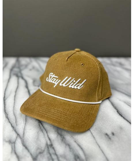 A corduroy hat with an embroidered ‘Stay Wild’ logo, white rope detail, and adjustable strap. Available in four colors.