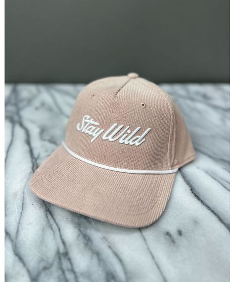 A corduroy hat with an embroidered ‘Stay Wild’ logo, white rope detail, and adjustable strap. Available in four colors.