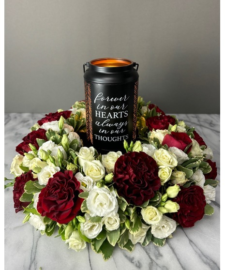 red and white floral surround for urns and memorial services