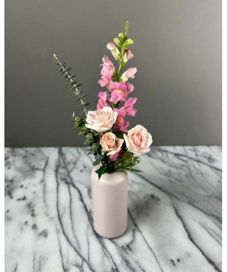 A set of individual vases, each holding a single-stem rose with greenery. Available in single, 2, or 3 vase options for a minimalist and elegant look.