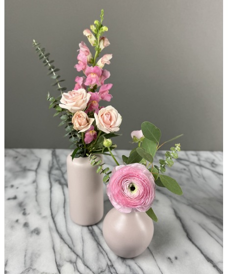 A set of individual vases, each holding a single-stem rose with greenery. Available in single, 2, or 3 vase options for a minimalist and elegant look.