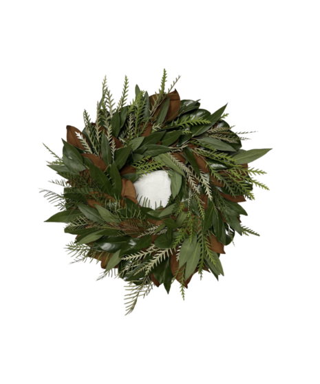 A fresh holiday wreath crafted with lush greenery and magnolia leaves, perfect for doors, mantels, or festive decorations.