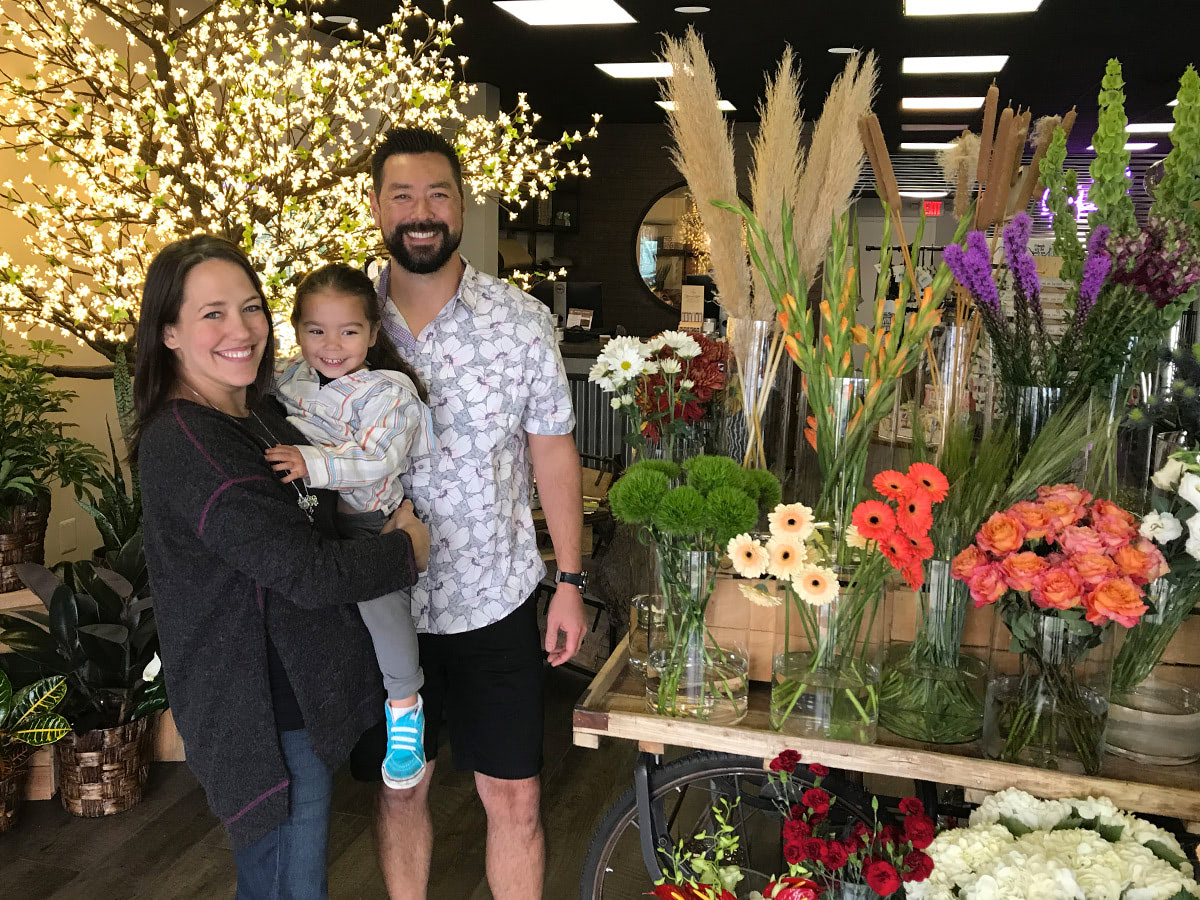 On grand opening day, the Guenther family smiles inside their brand new showroom