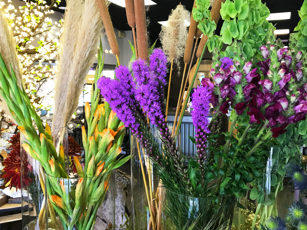 Lush purpose flowers and colorful arrangements, awaiting their new home